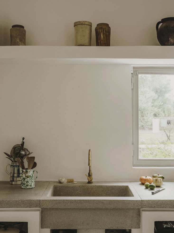 a gently tarnished brass faucet and a green splatterware jug. (for something si 22