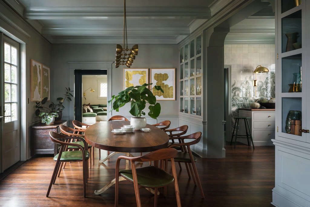 The two-story house had been at one time converted into apartments. Though it had been turned back into a single-family home by the previous owners, there were still awkward remnants of its rental past, including a second, extraneous staircase. 