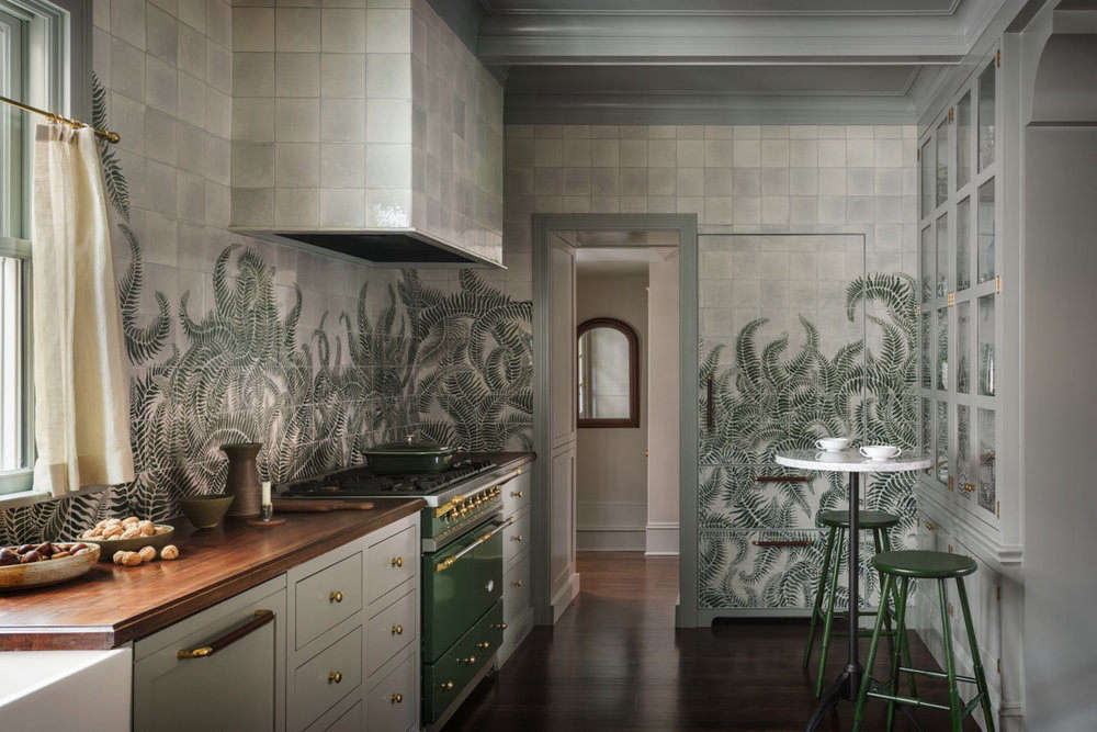 The mural extends to every wall in the kitchen—and even covers the built-in refrigerator 