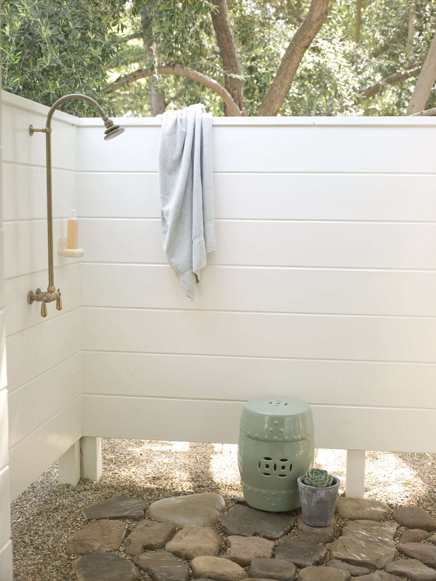 The added outdoor shower, paved with natural stones. Not shown: the studio