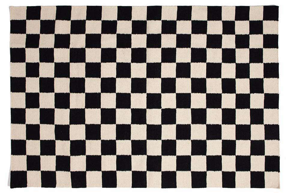 Jonathan painted the black and white checkered floor himself. For a great DIY tutorial, go here. Not up for the project? Consider this wool and cotton Checkmate Flatweave Rug by Aelfie; $89 to $data-src=