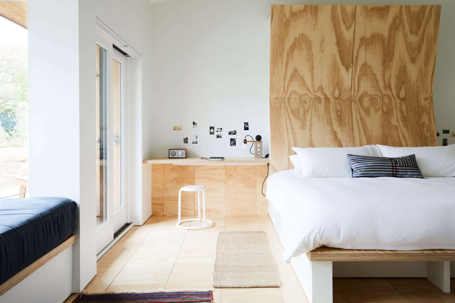 All the guest rooms have a neutral palette. Pictured is the Archer Suite, which can accommodate five guests.