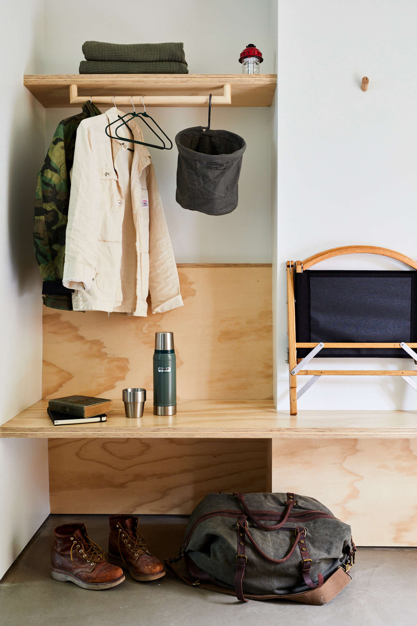 The entryway to a guest room. The folding camp chair can be purchased from the hotel shop.