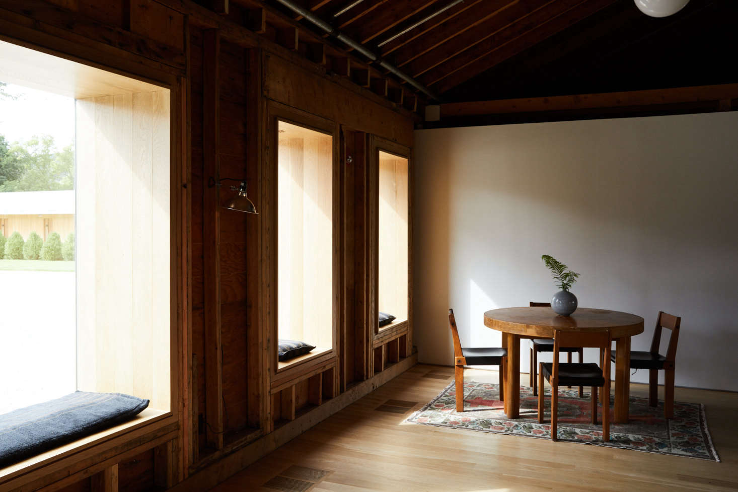 A quiet corner in the lobby. Oversized casement windows flood the space with light.