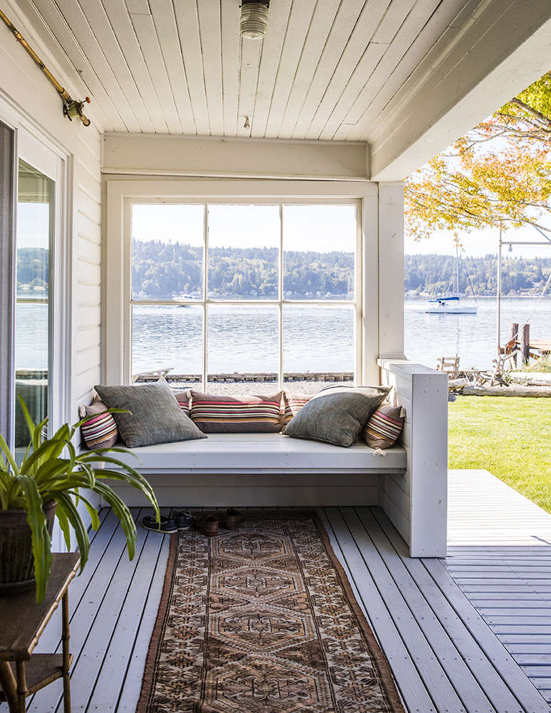 The couple added a window to the original front porch to make it an all-season sitting area.
