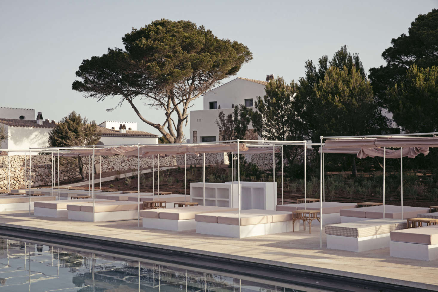 Canopied mattresses for one and two surround the -meter pool.