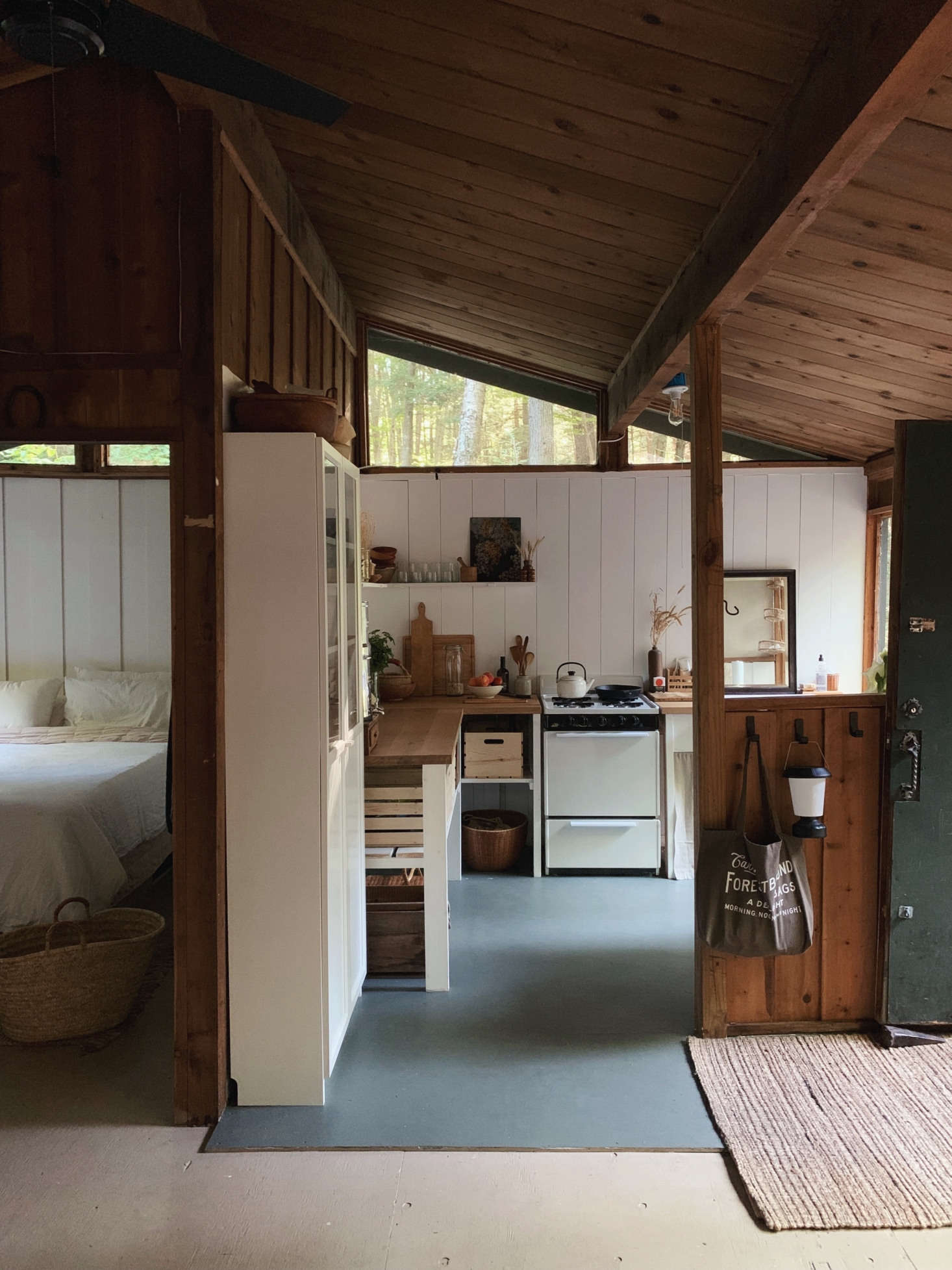 Inside the small cabin, with the newly rehabbed kitchen straight ahead.