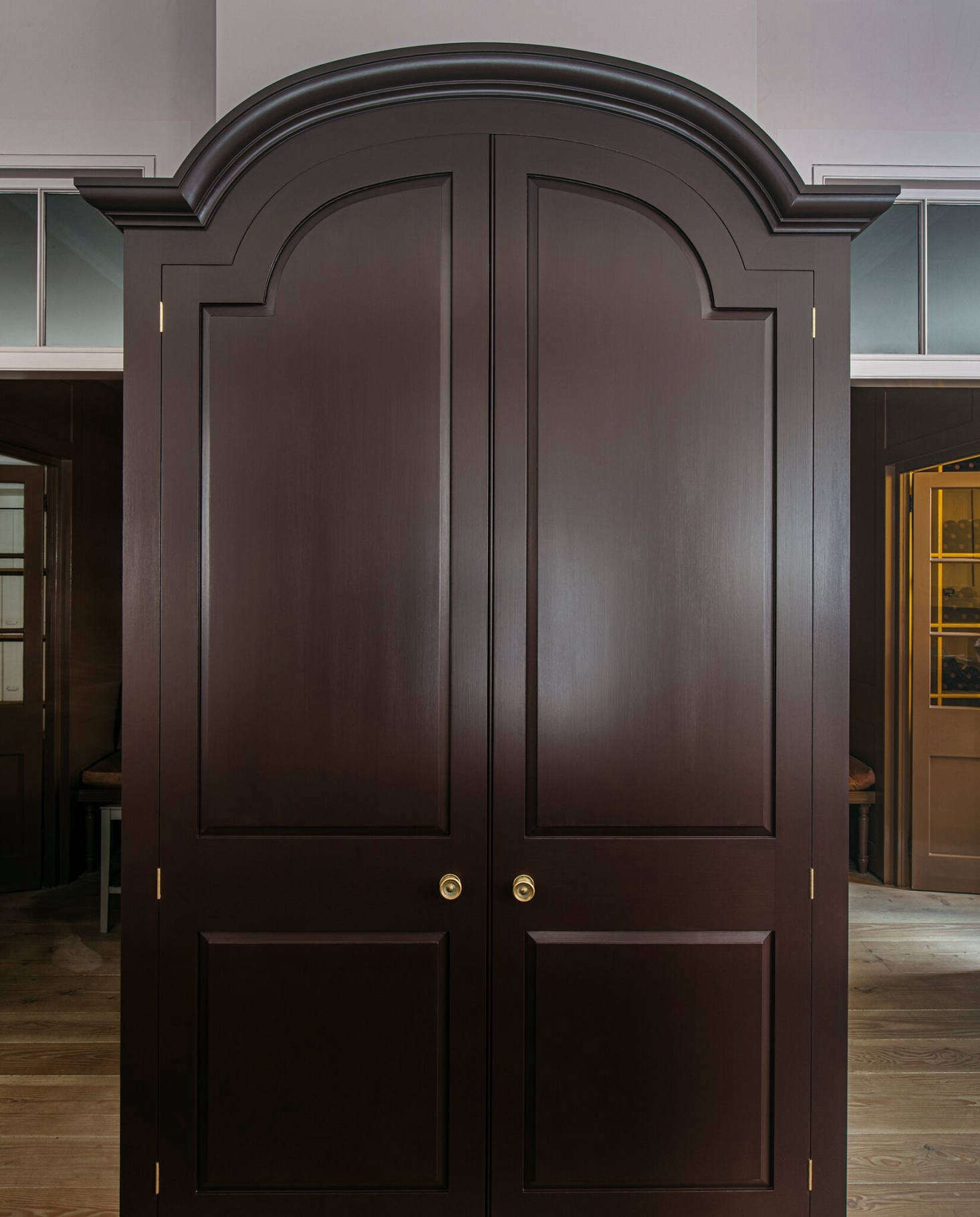 A freestanding cupboard in the Marylebone showroom is painted in Burnt Toast on the exterior.