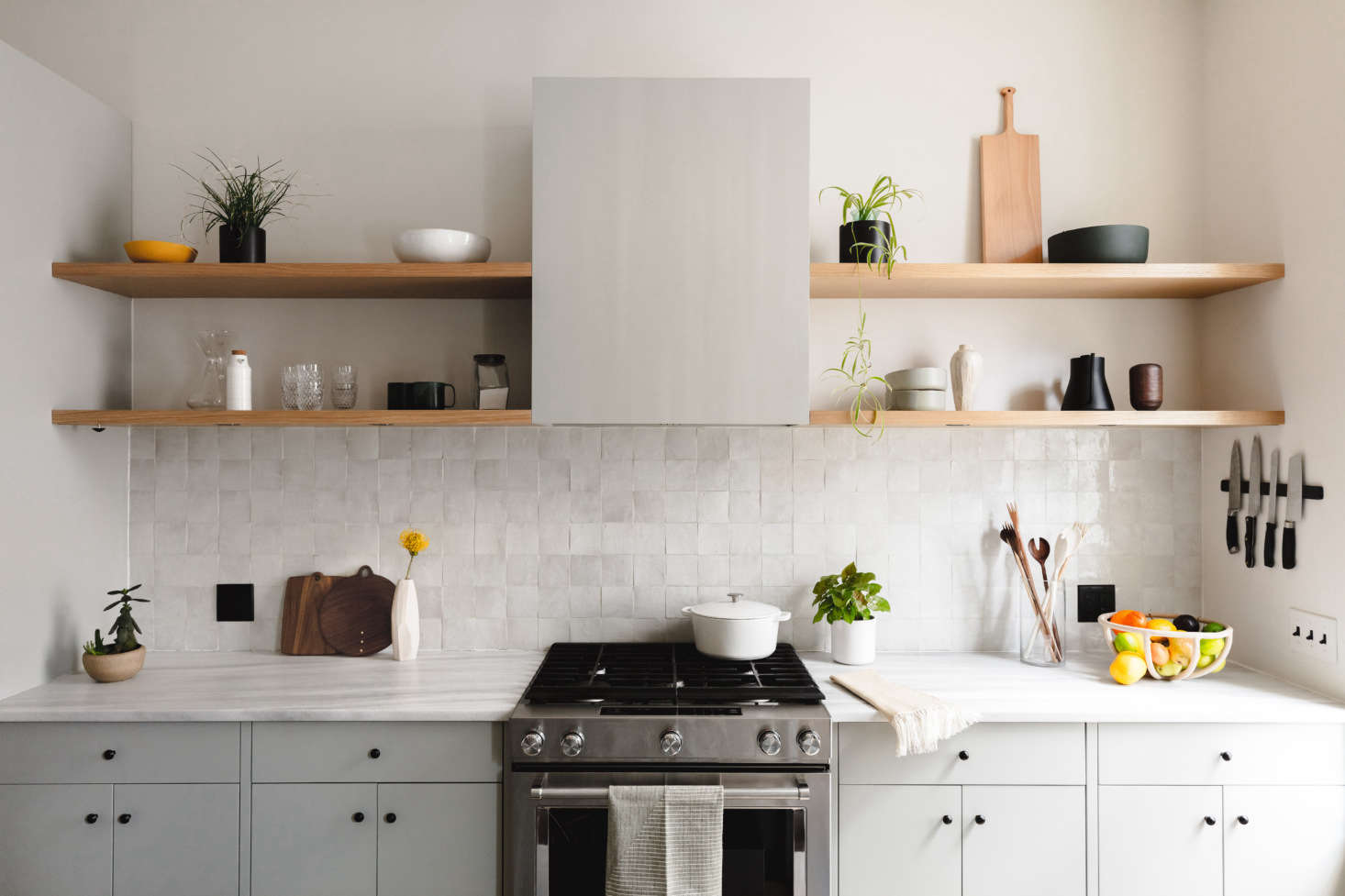 As with all Shapeless projects, the cabinetry is the careful work of James Harmon of Workshop Brooklyn, who honed his craft by studying wooden boat building. The flush panel fronts are painted Sea Haze from Benjamin Moore: 