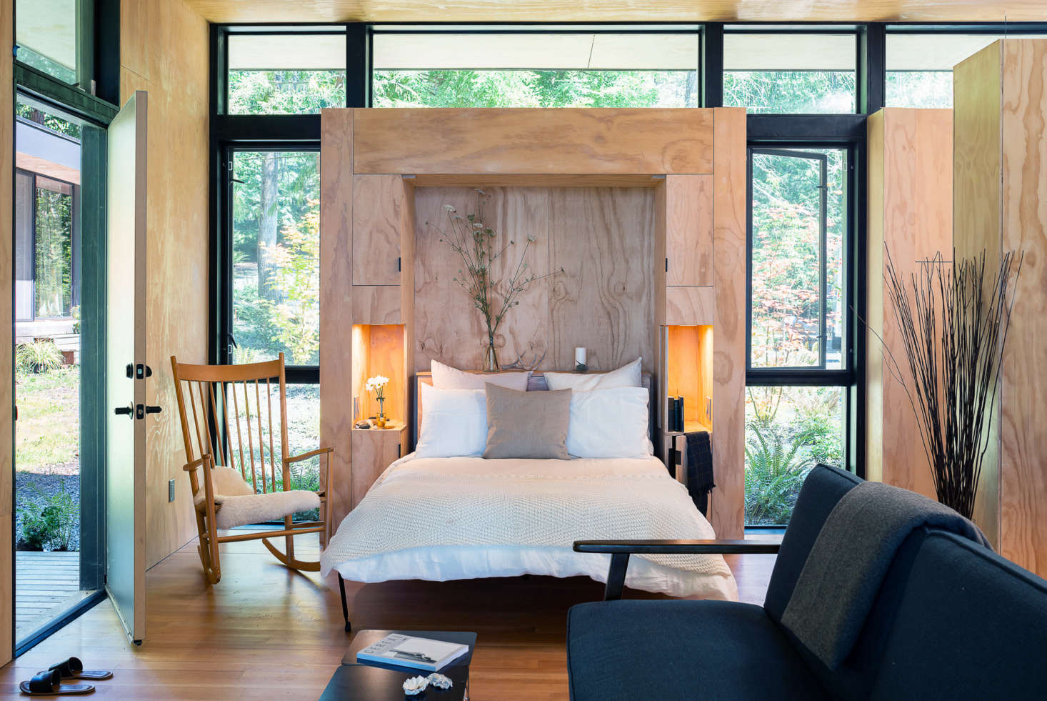 Wittman Estes integrated the Murphy bed into a cabinet with side tables, linen storage, and reading lights.