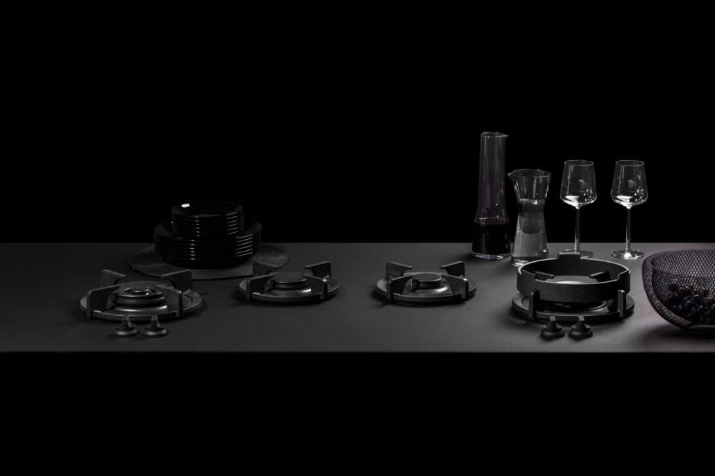 A matte black counter with inset burners.
