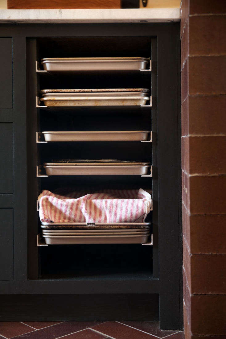 beside the wood stove, a professional inspired speed rack fits into the space o 15