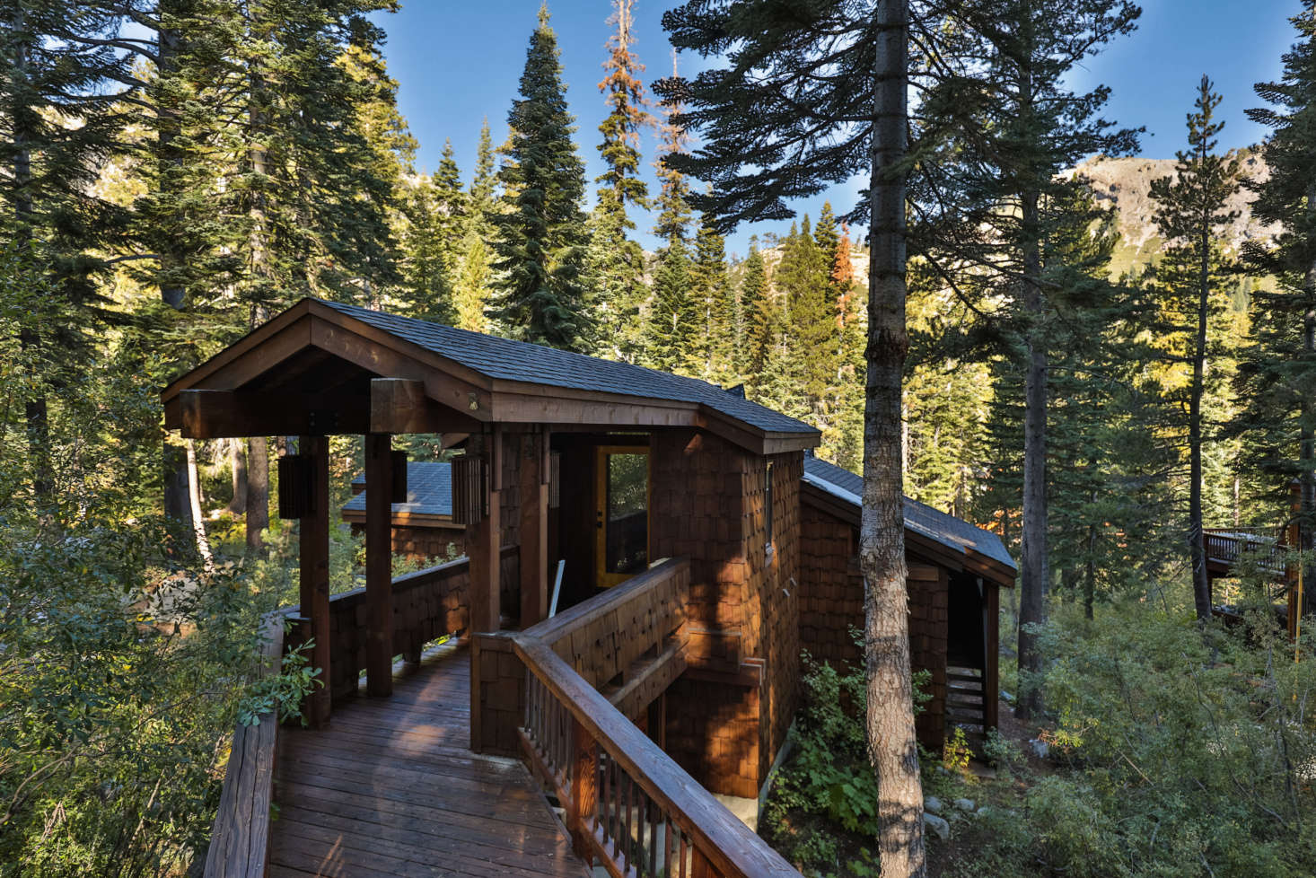 The shingled cabin was originally designed in 73 by Tahoe-based architect Charles O. Matcham Jr.; it