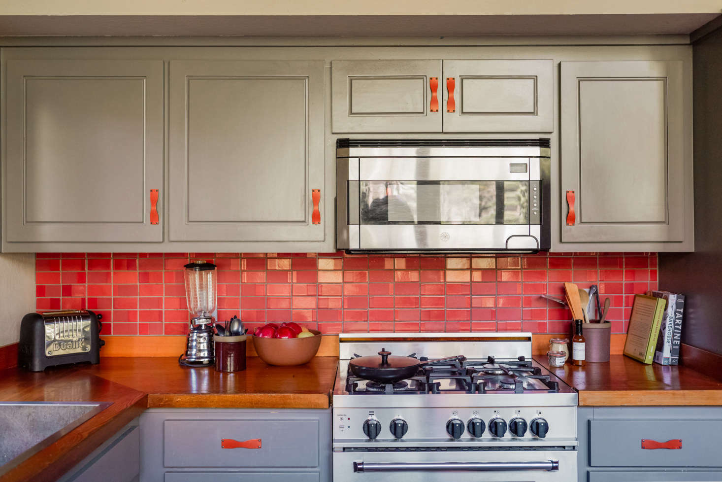 The two-tone kitchen features Heath