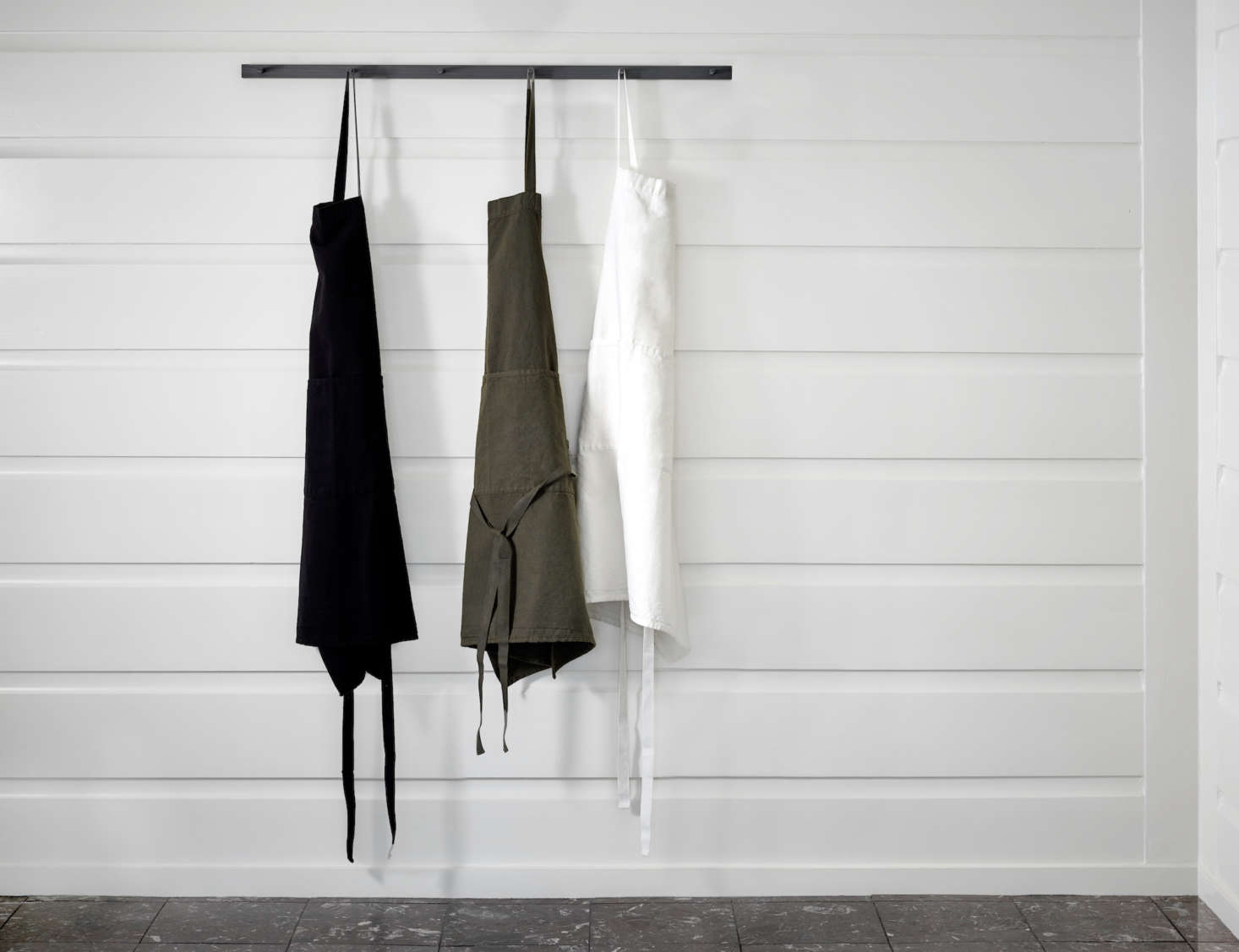The cotton/linen Apron ($78) is made by Charvet in France and is available in black, ivy, or white.