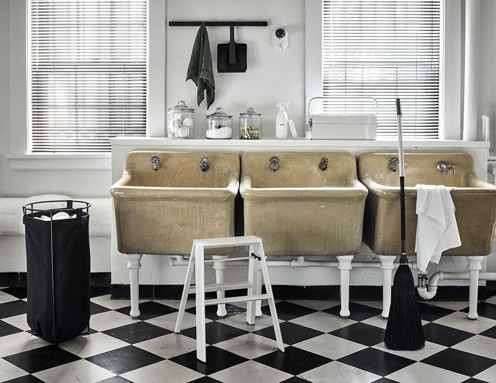 A laundry room outfitted with Kept products, including the handmade Custodian Broom.
