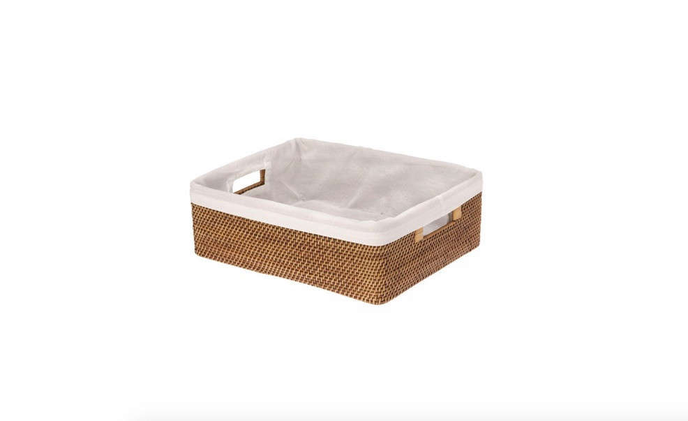The Laguna Rattan Shelf Basket by Kouboo comes with a removable cotton liner; $49.50.