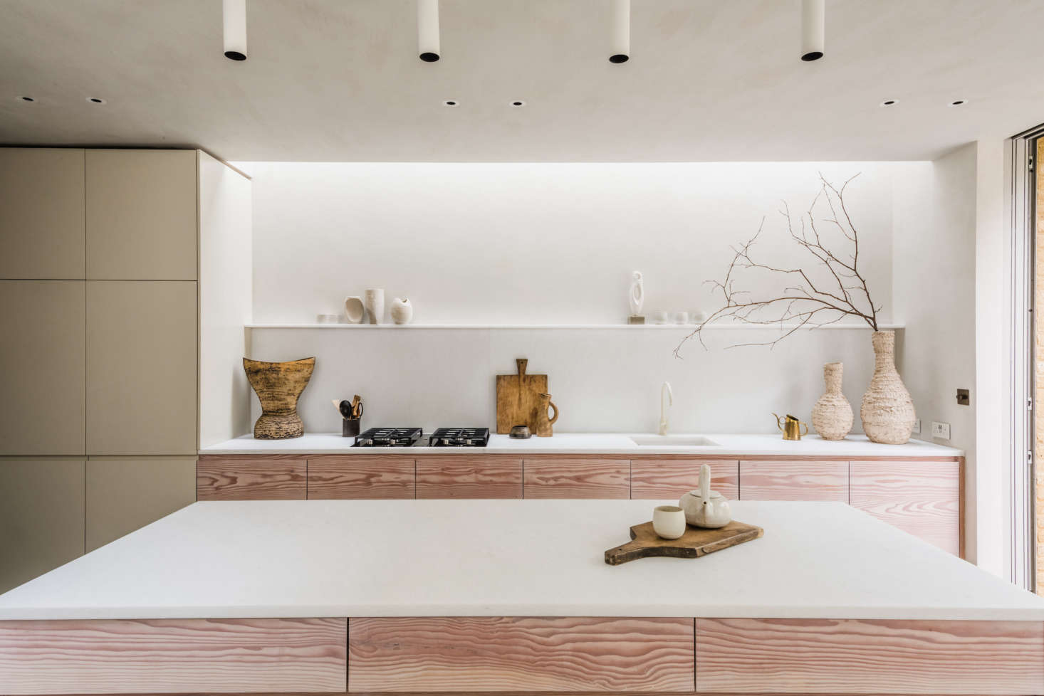 Evora marble tops the bespoke Douglas fir kitchen cabinets.