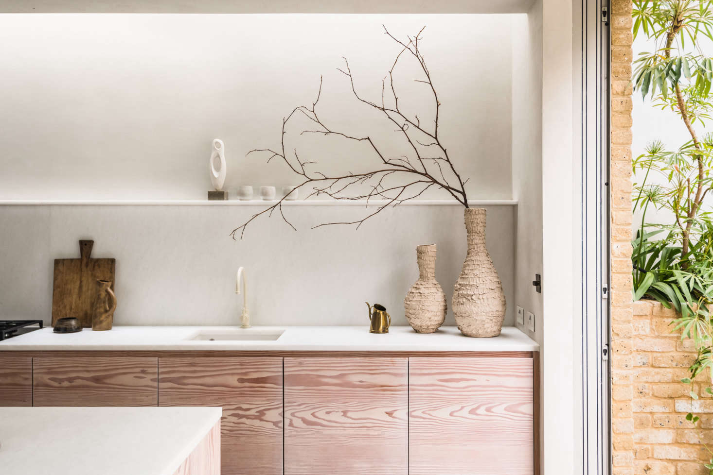 The powder-coated brass faucet is from Studio Ore. 