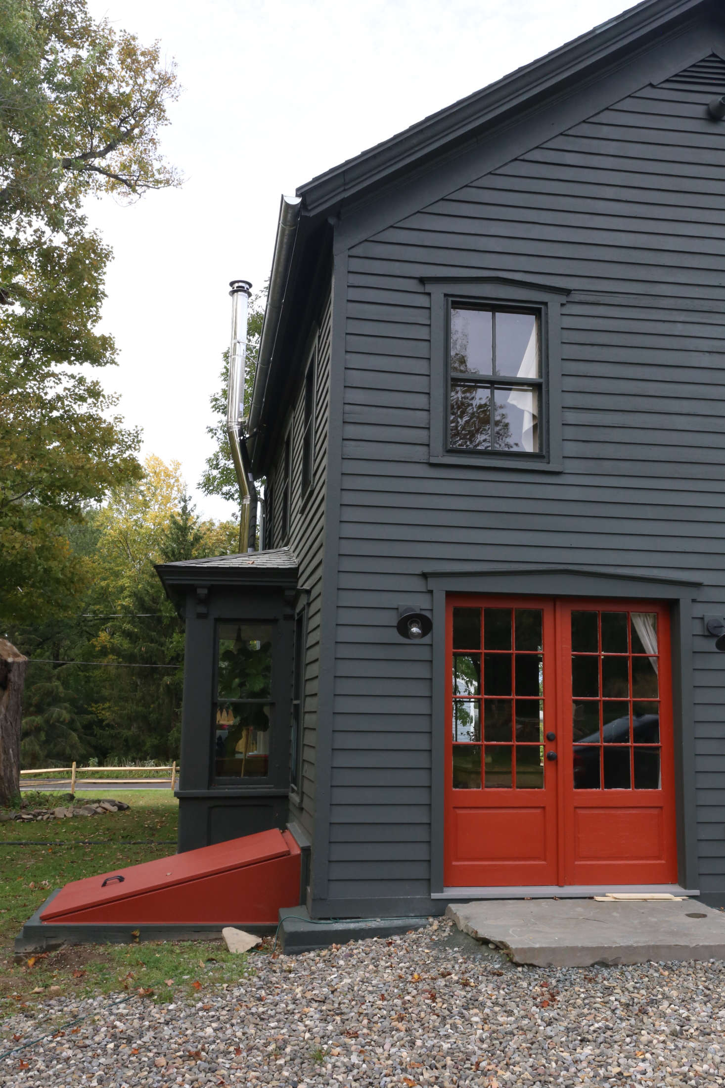 The back doors and basement bulkhead are also Benjamin Moore Grand Canyon Red: 