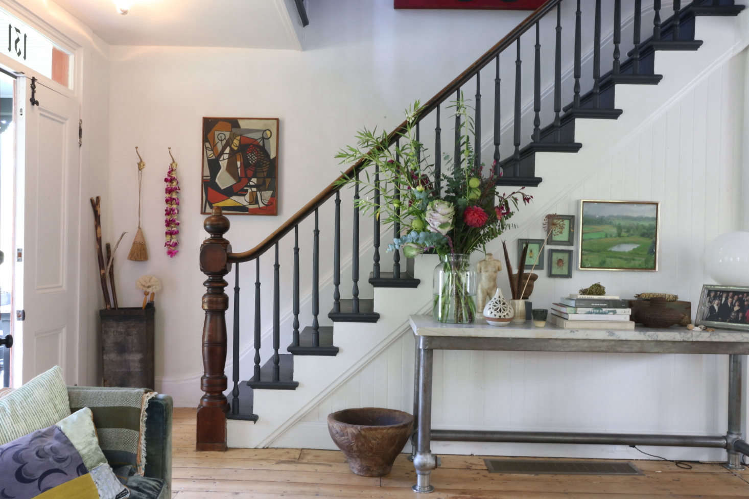 The front door opens to the original staircase: 