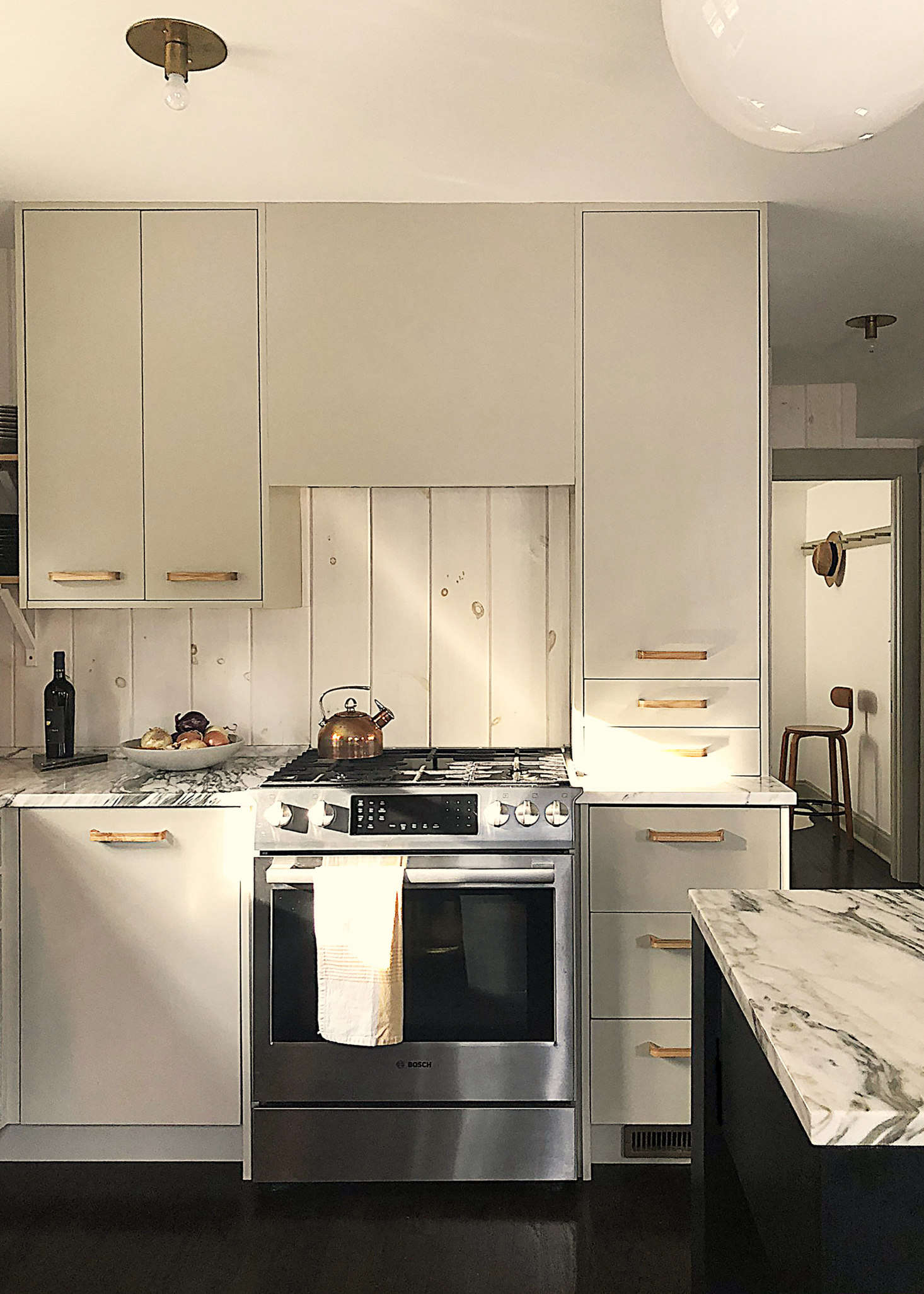 The stove is a Bosch with an under-cabinet vent. The Ellis Wood Cabinet Pulls, $