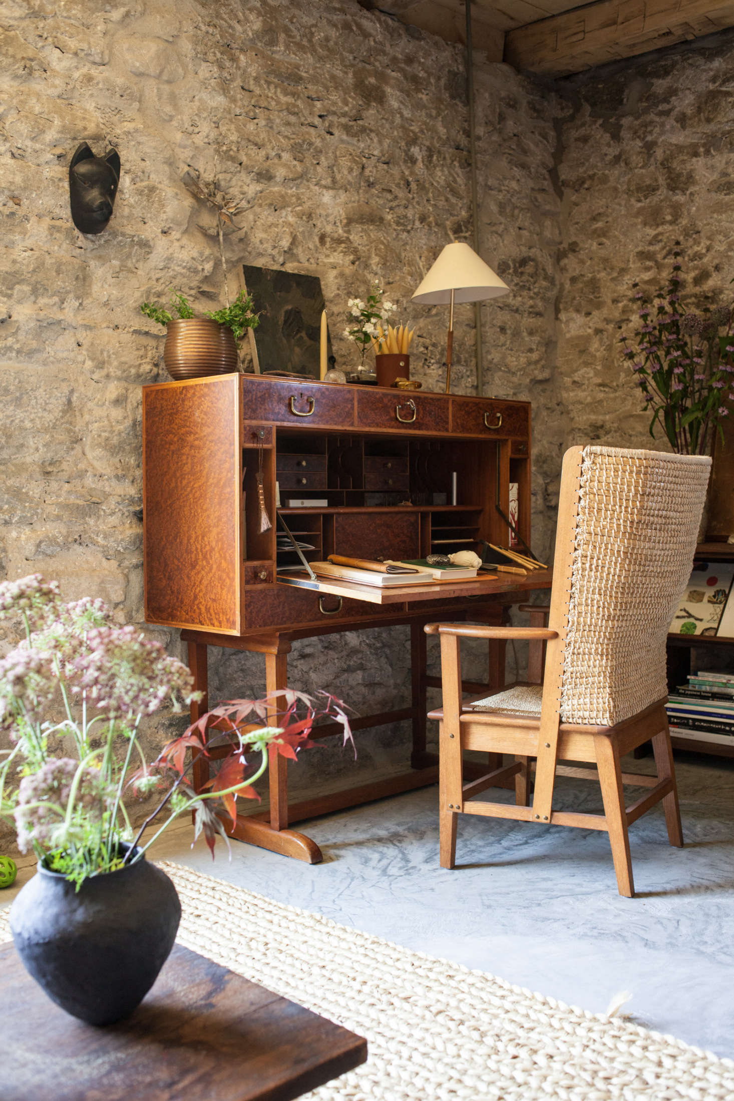 Flowers and greenery animate the study, featuring a Josef Frank Secretaire, of John and Juli Baker