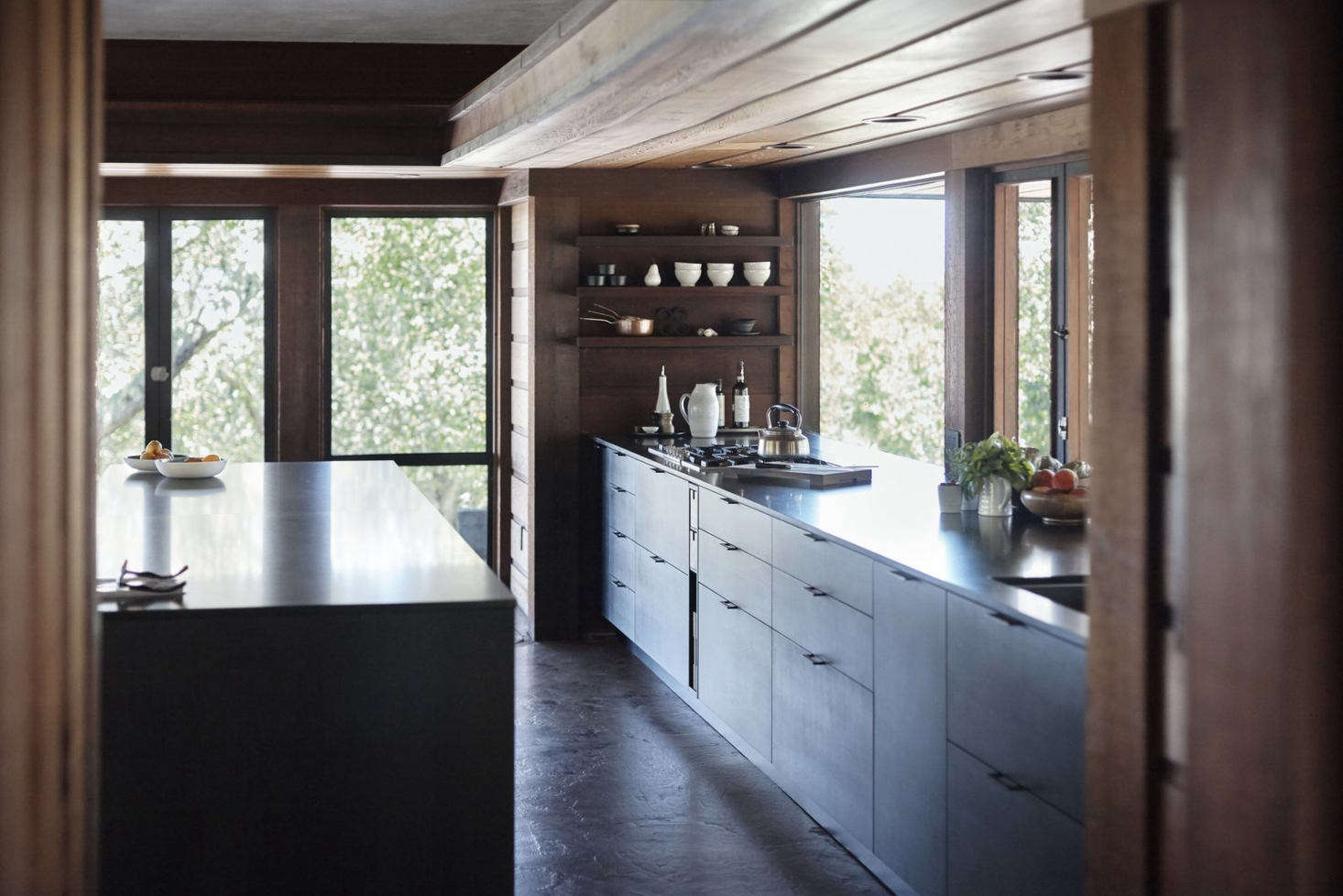 The house is constructed of old growth redwood. Janet and Mark preserved the original polished concrete floors, which have radiant heating.