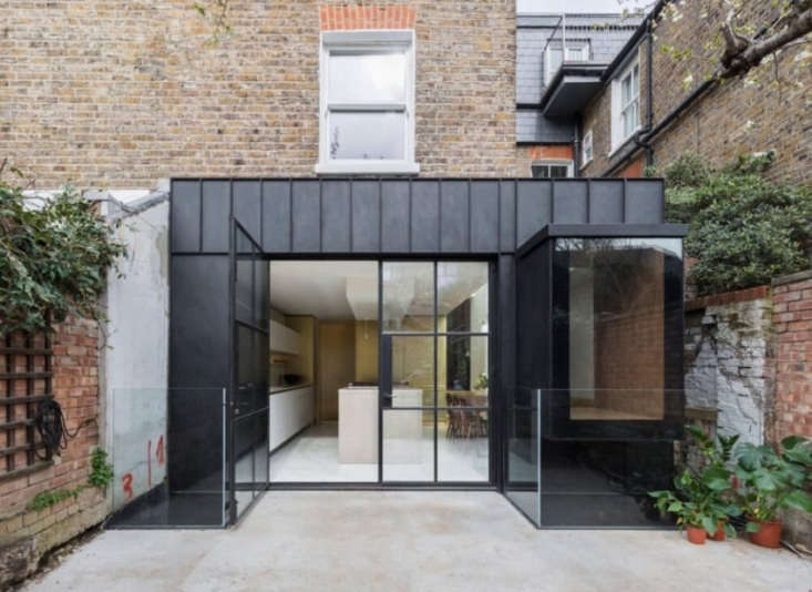 the extension is clad in handmade matte black steel panels that astridge says & 17