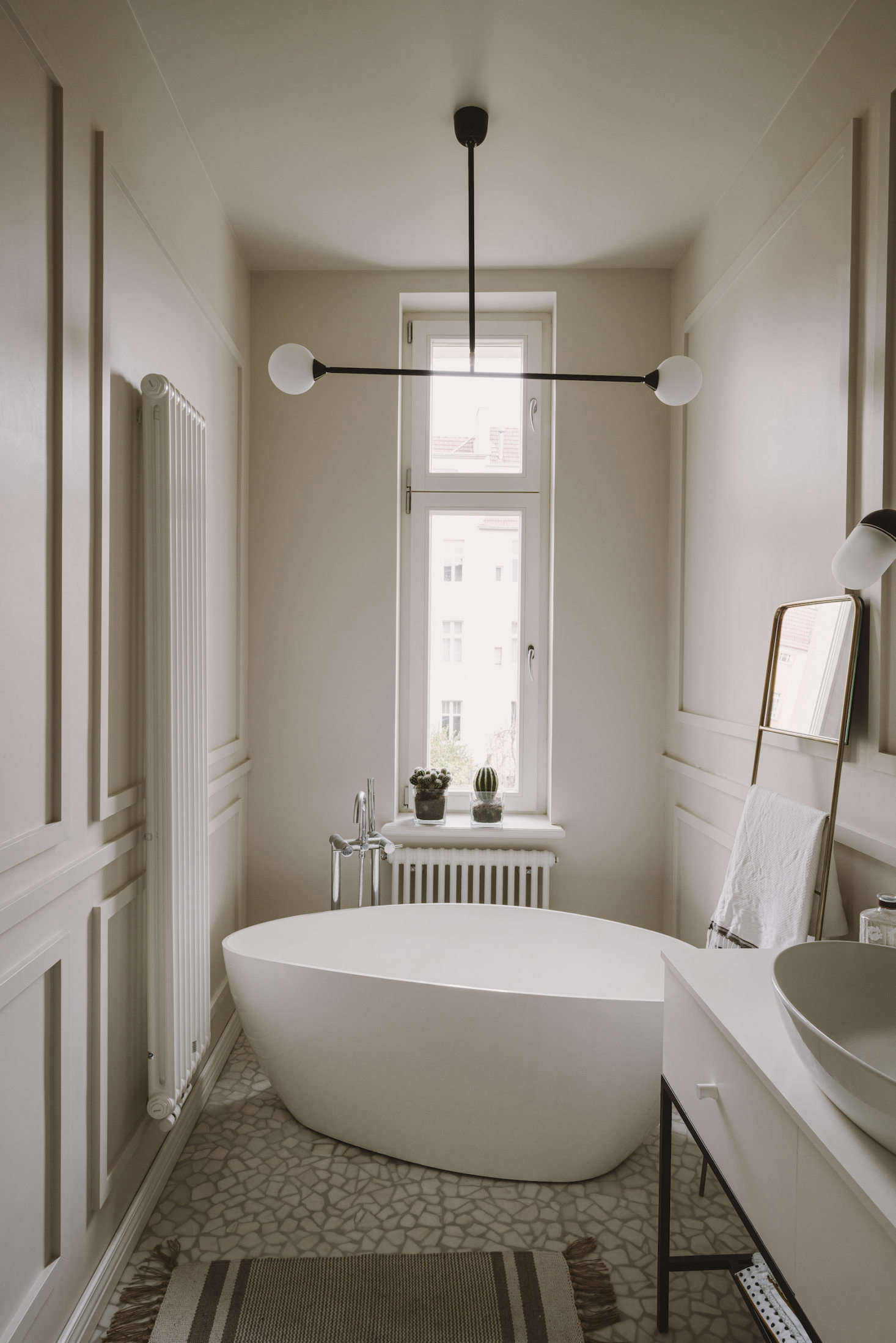 Another eBay score: the leaning towel rack. The bathtub is by Omnires. The marble tiles that resemble bits of shells and pebbles found on the beach are from a small workshop.