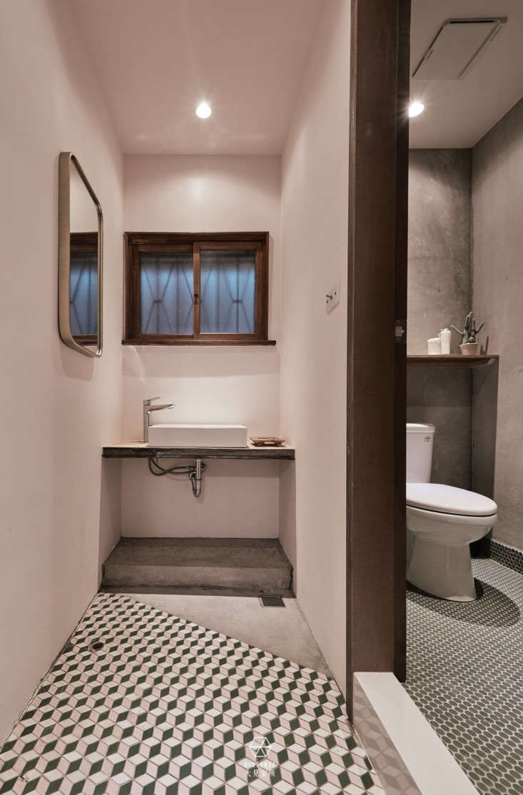 circles meet squares in the bathroom floor tiles. the basin and faucet are by b 27