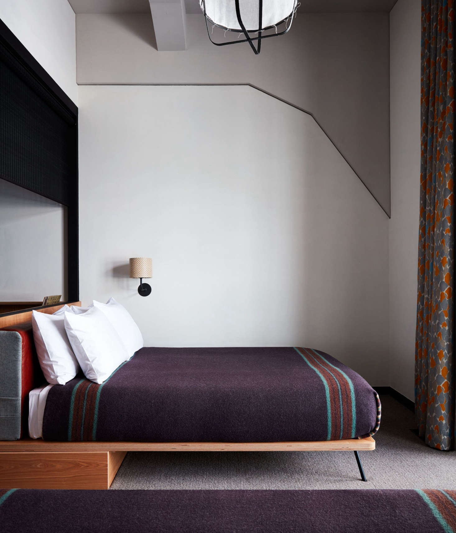 Minimalist platform beds simply covered with custom wool blankets made by Pendleton specifically for the hotel. After April , the blankets will be available for purchase in Ace