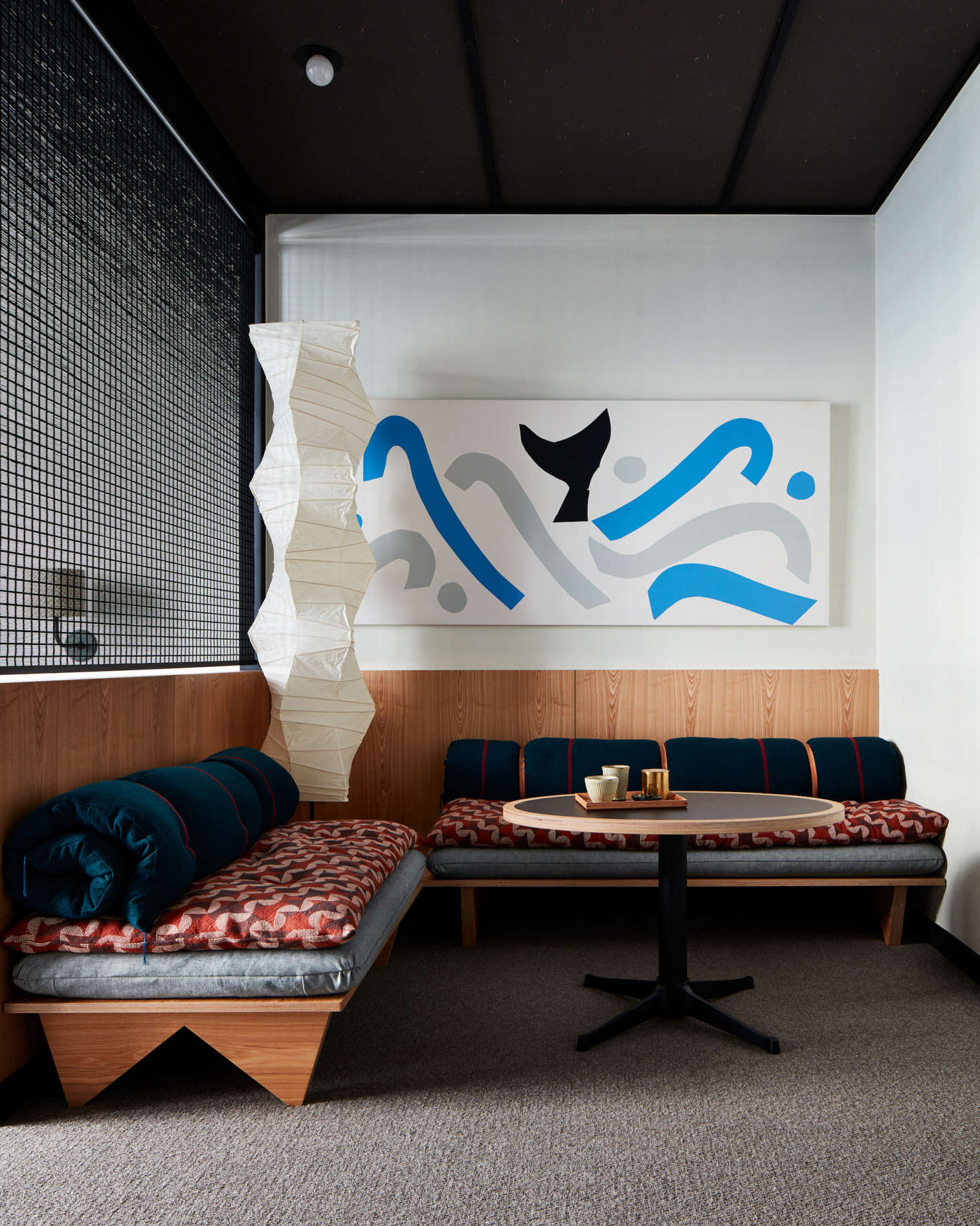 Art by local artists is displayed throughout the hotel. A classic Akari Noguchi floor lamp presides over the sitting area of a guest room. (See data-src=