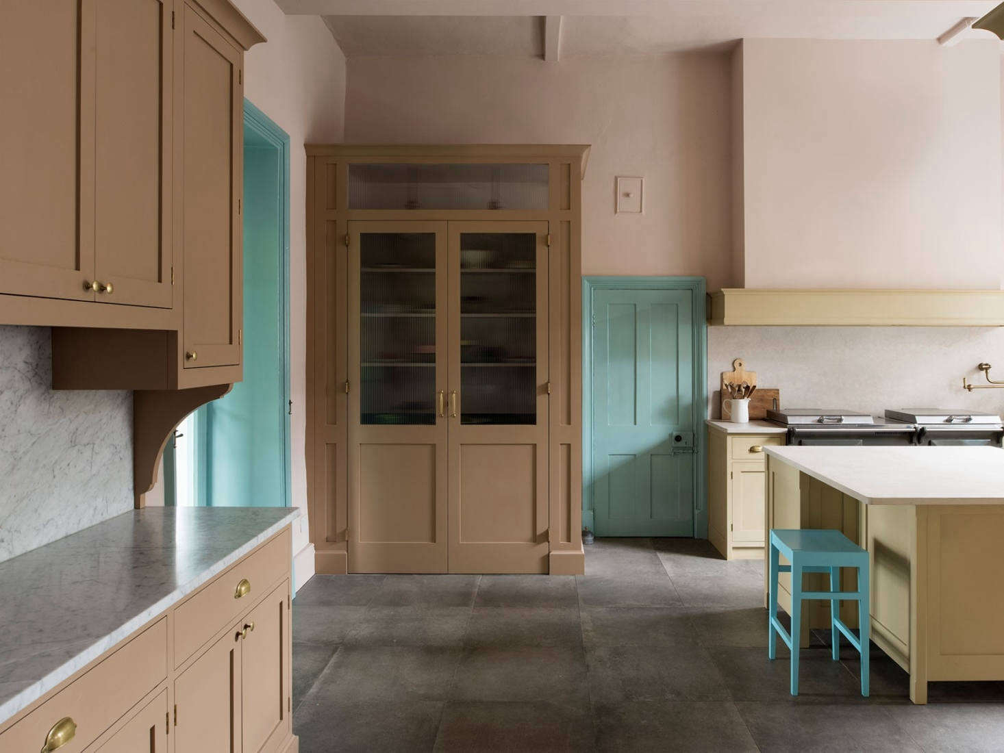 The kitchen includes a large larder and sideboard painted in drab brown. Photography by Leigh Simpson, courtesy of Inglis Hall from Kitchen of the Week: An Unexpected Palette in a Custom Kitchen Designed by Inglis Hall.