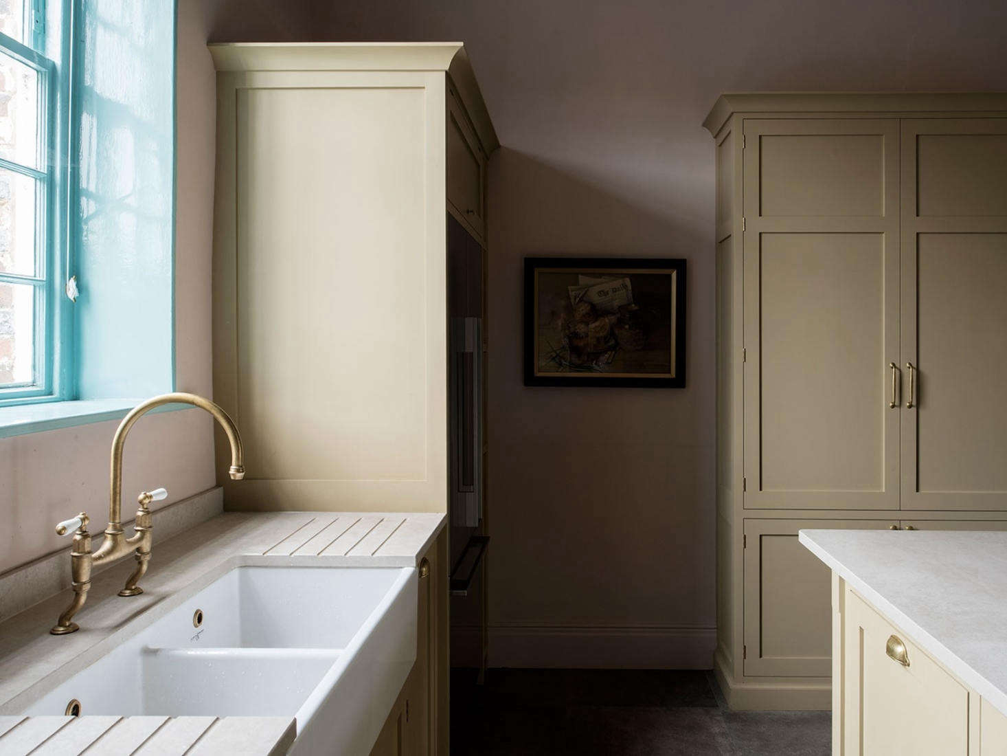Caesarstone countertops and a vintage-style sink and faucet. Photography by Leigh Simpson, courtesy of Inglis Hall from Kitchen of the Week: An Unexpected Palette in a Custom Kitchen Designed by Inglis Hall.