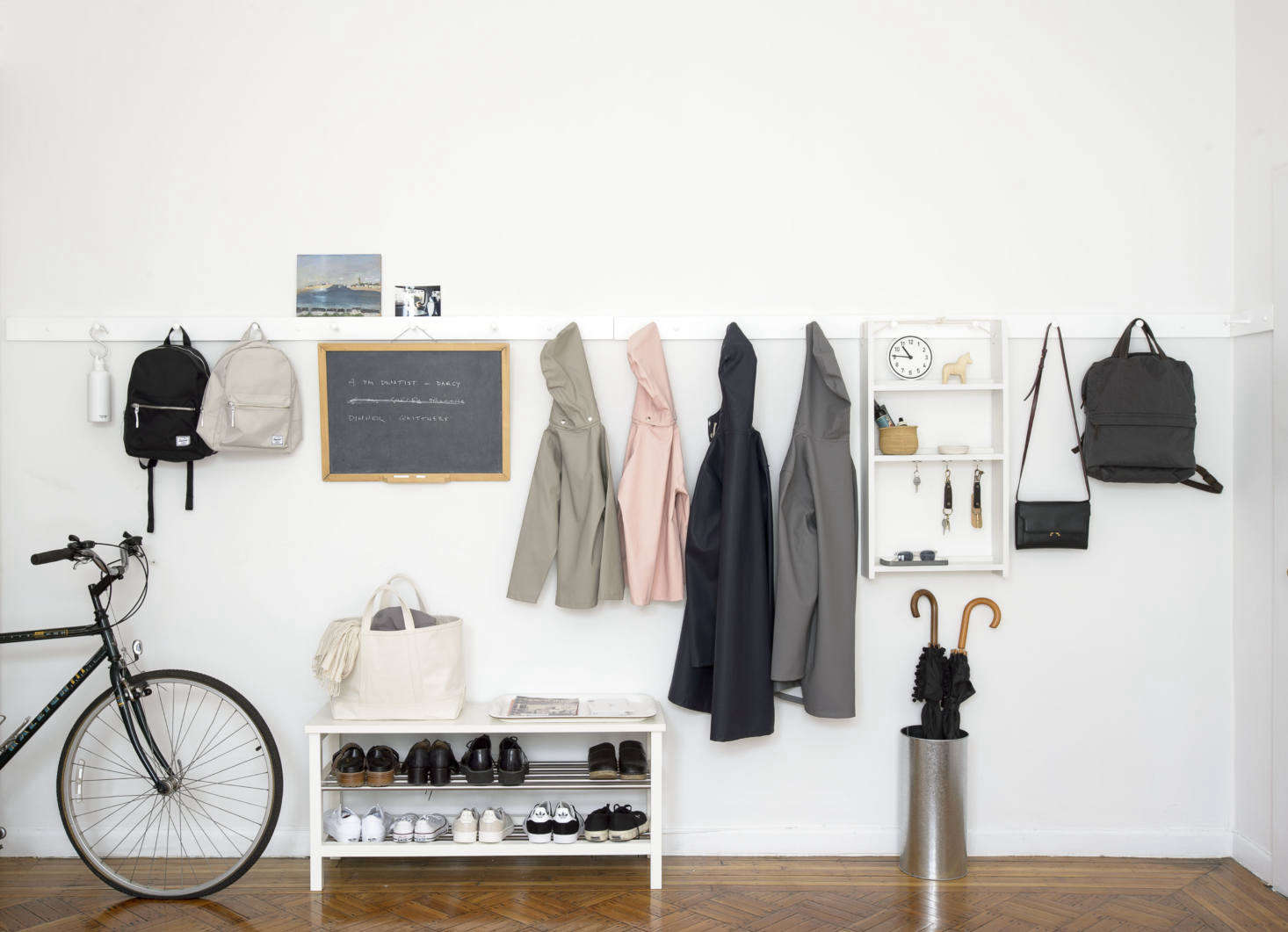 Our all-time favorite approach to organization? Put up a Shaker-style peg rail and gain instant order. Shown here, a rail made by Michigan workshop Peg and Rail from our book The Organized Home. Photograph by Matthew Williams for Remodelista.