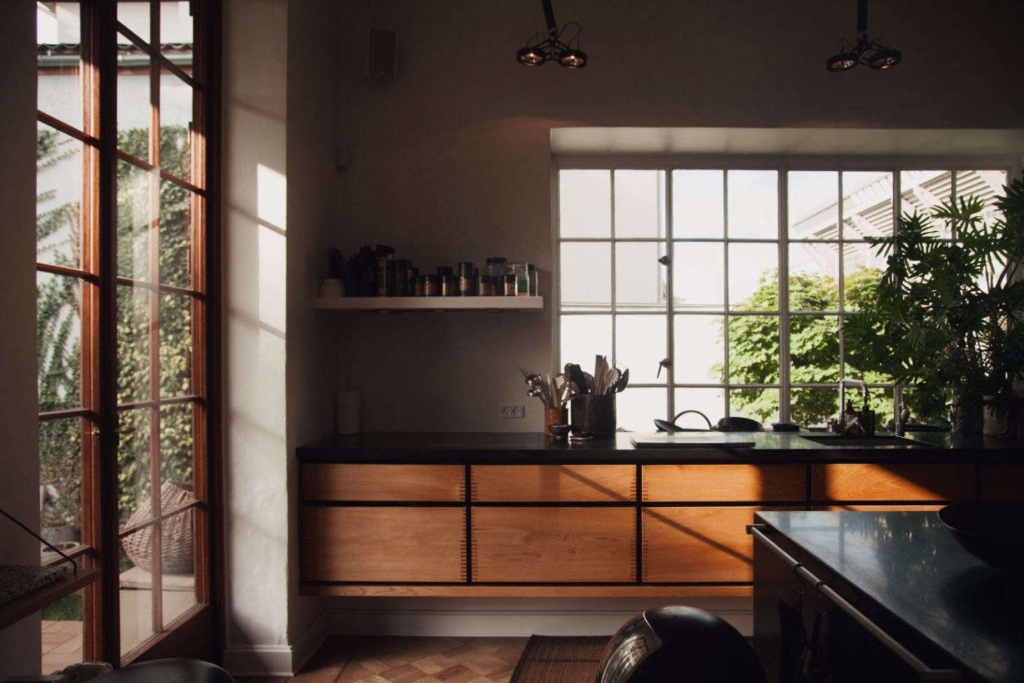 The Garde Hvalsøe kitchen with floating Dinesen wood cabinets and a slate counter.