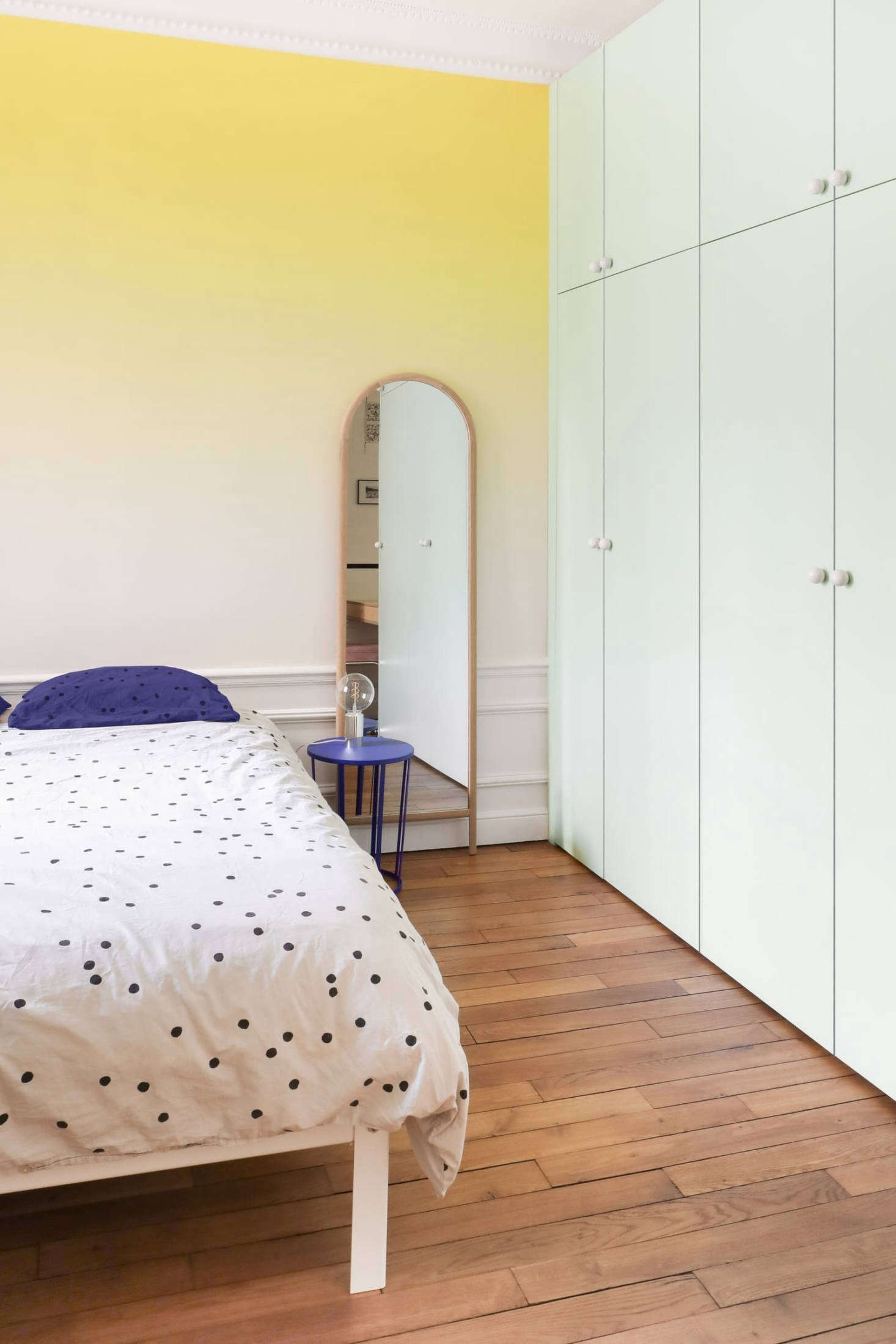 The master bedroom is cloaked in an ombre palette courtesy of Sunset wallpaper from Bien Fait. The architects