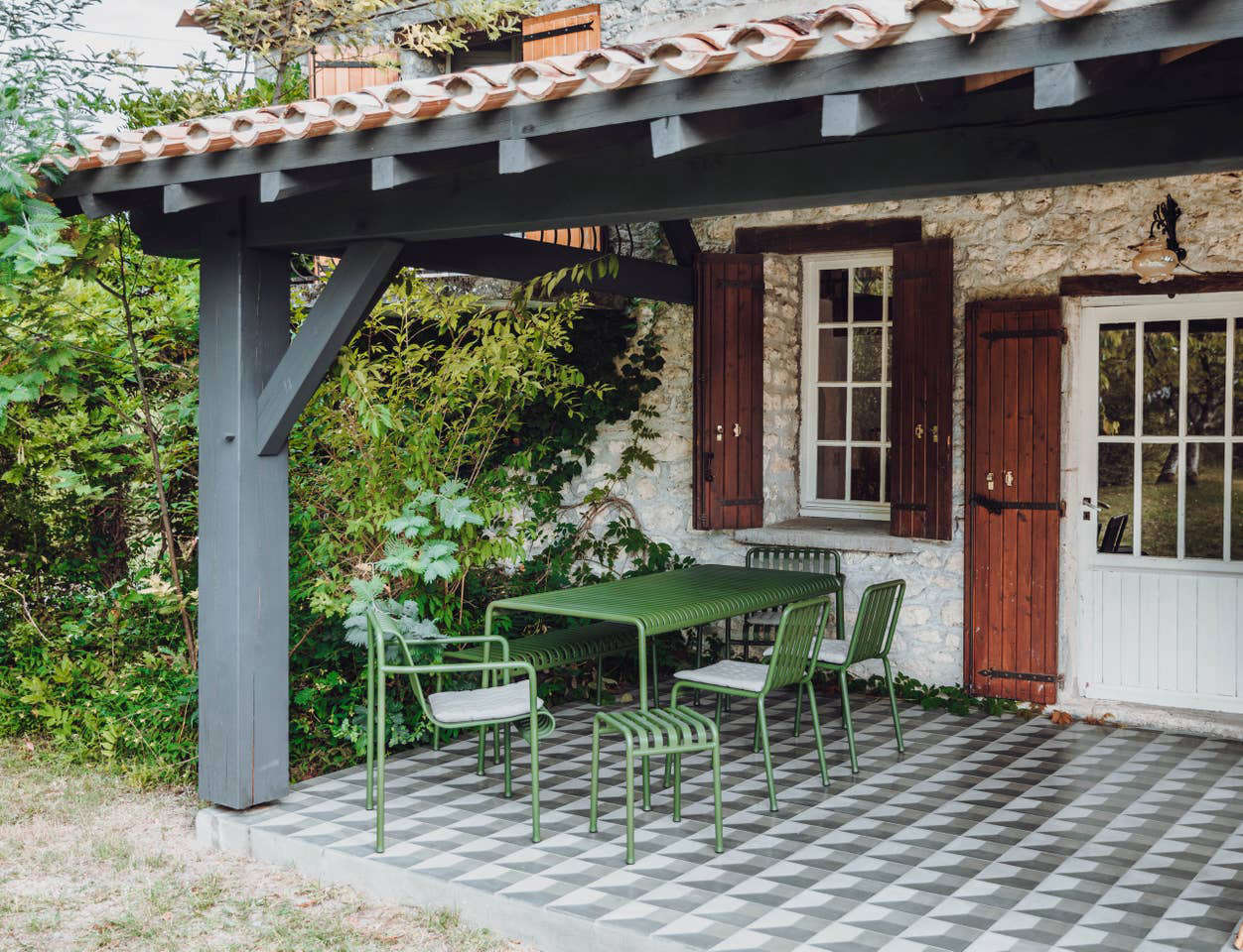 The terrace features the Pallisade Dining Set by Ronan and Erwan Bouroullec for HAY.