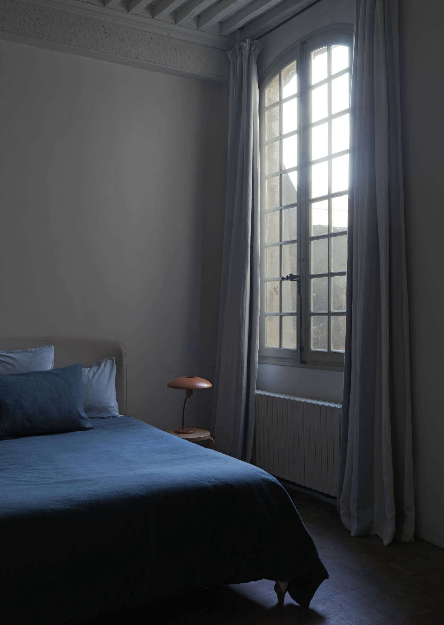 In another bedroom, a John Lewis bed is dressed with Toast bedding.