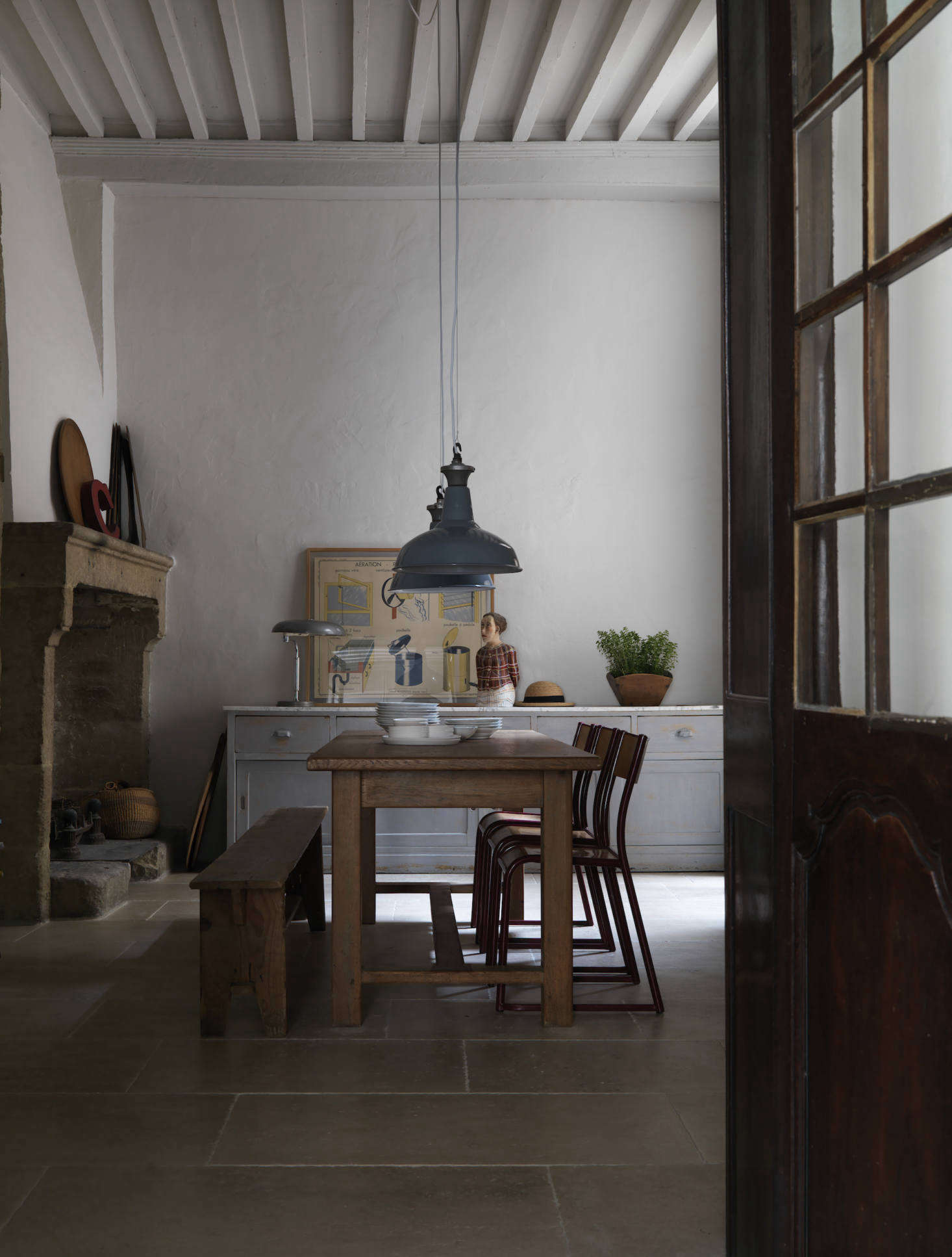 The fireplace in the dining area is original to the home, built in data-src=