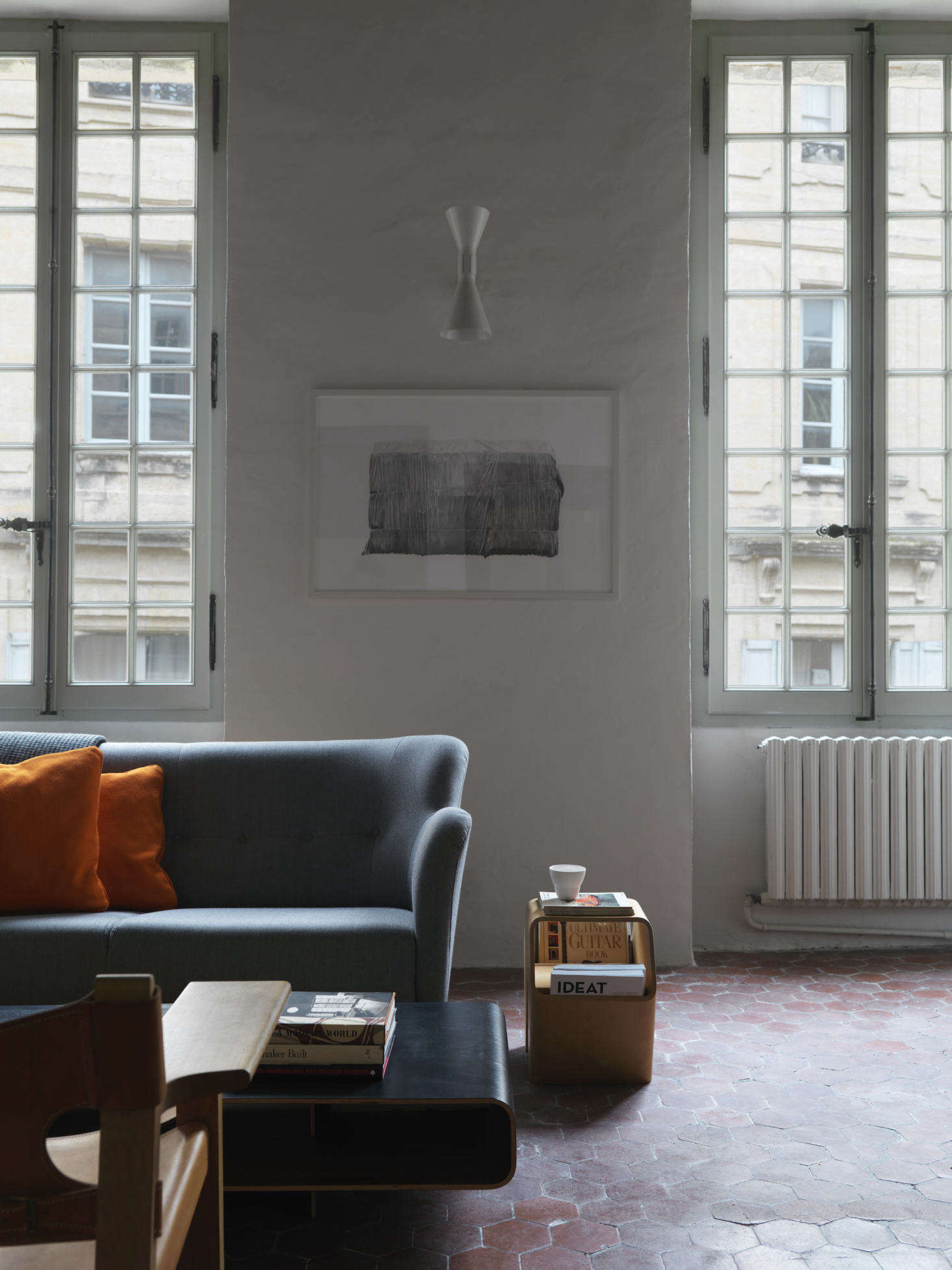 The tiled floor is original to the home. The sofa is from Swedese.