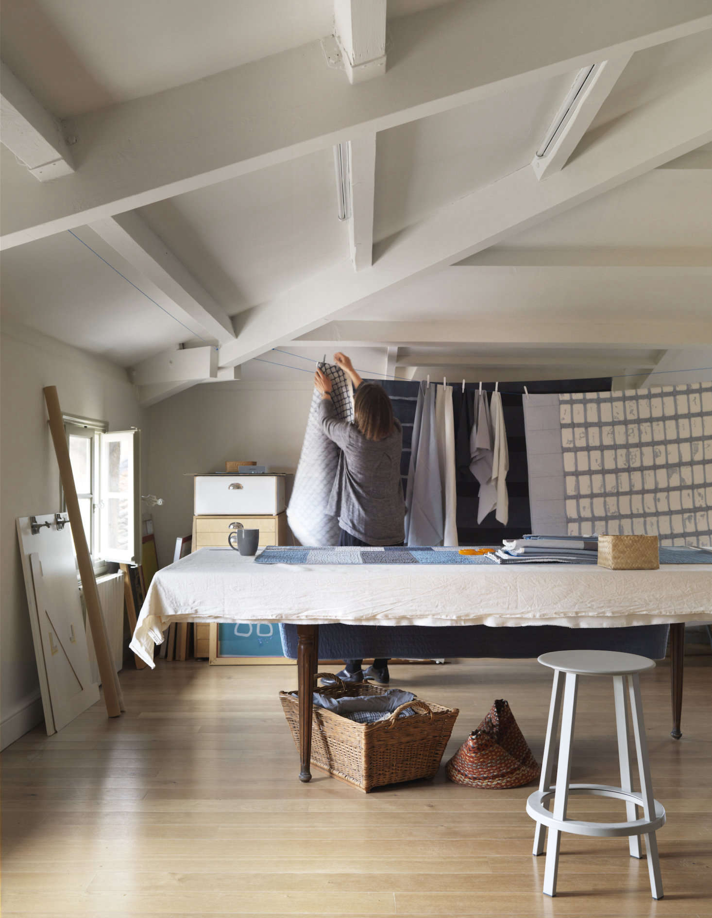 The couple have side-by-side studios (his for guitar-crafting, hers for textile-making). Pictured is Lone