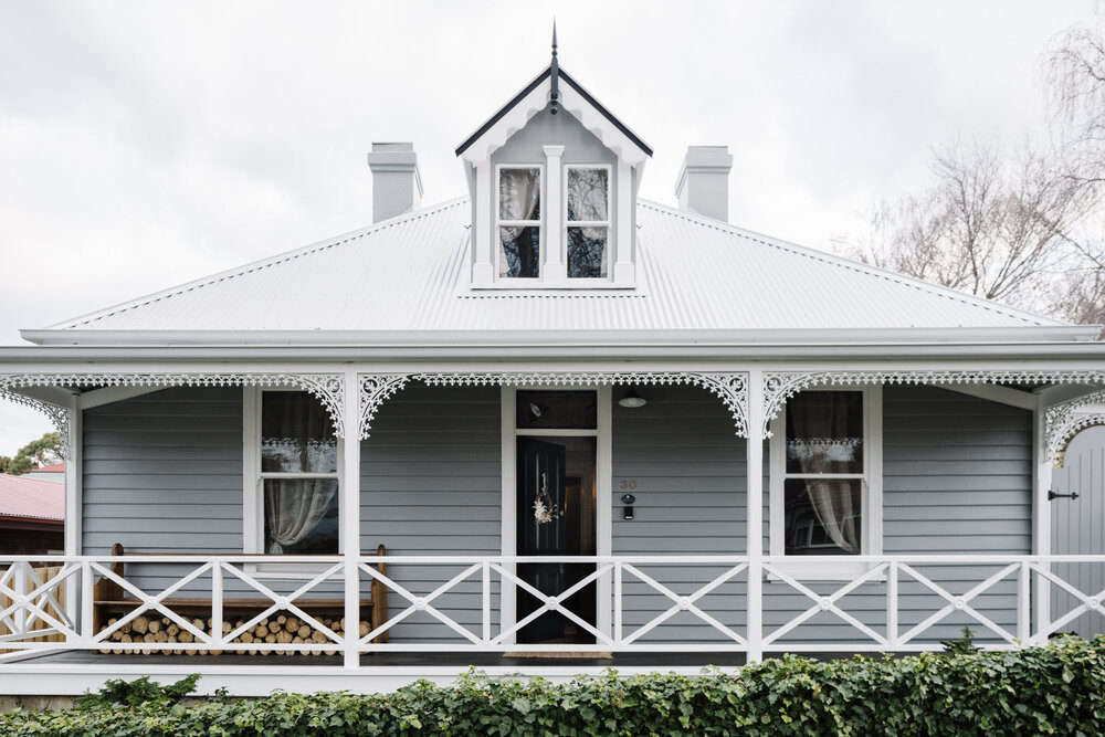 The cottage exterior—with gingerbread Victorian charm intact. 