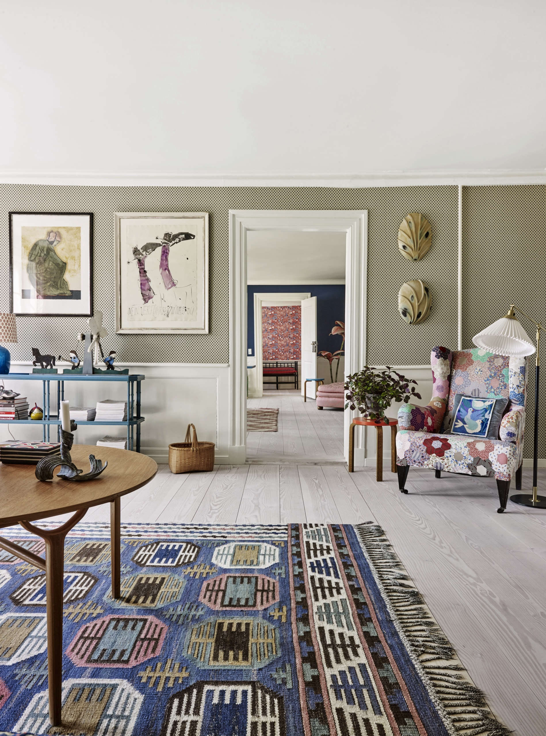 A wingback armchair with quilt upholstery at The Apartment DK
