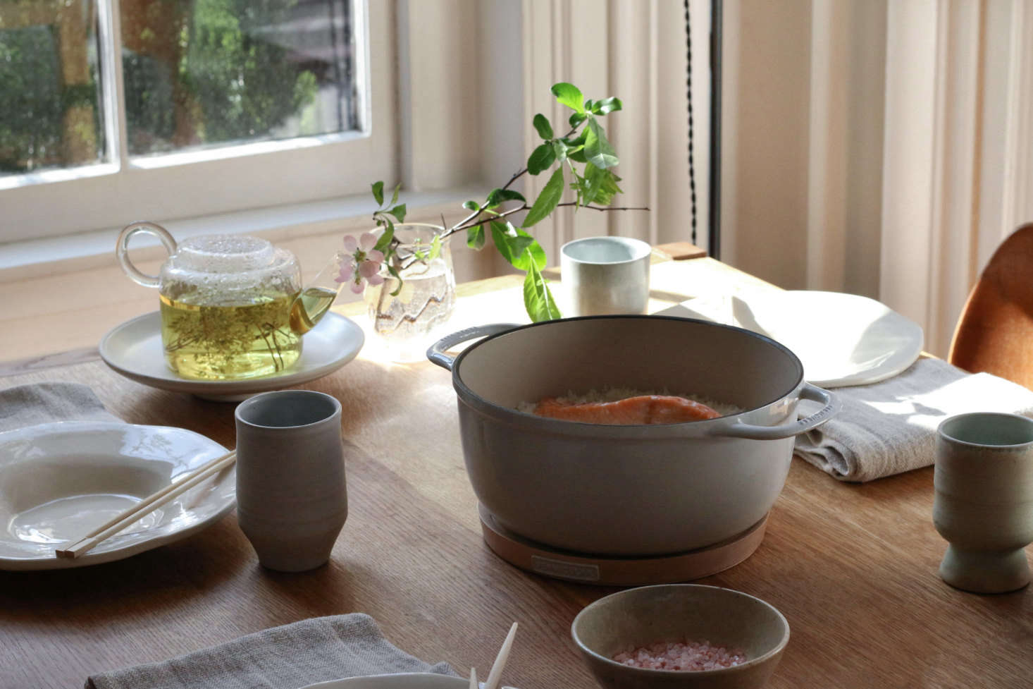 The Vermicular enameled cast iron pot can go straight to the table using the wood Magnetic Trivet, which attaches to the base of the pot, creating an instant (and attractive) heat barrier.