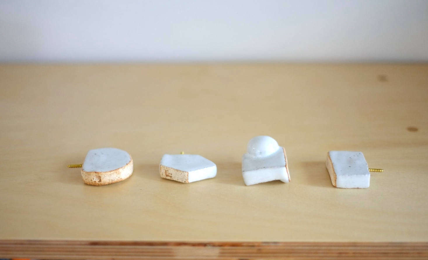LA-based industrial designer Juliana Hung of Juju Made offers a range of Ceramic Knobs that can be used as hooks; $38.