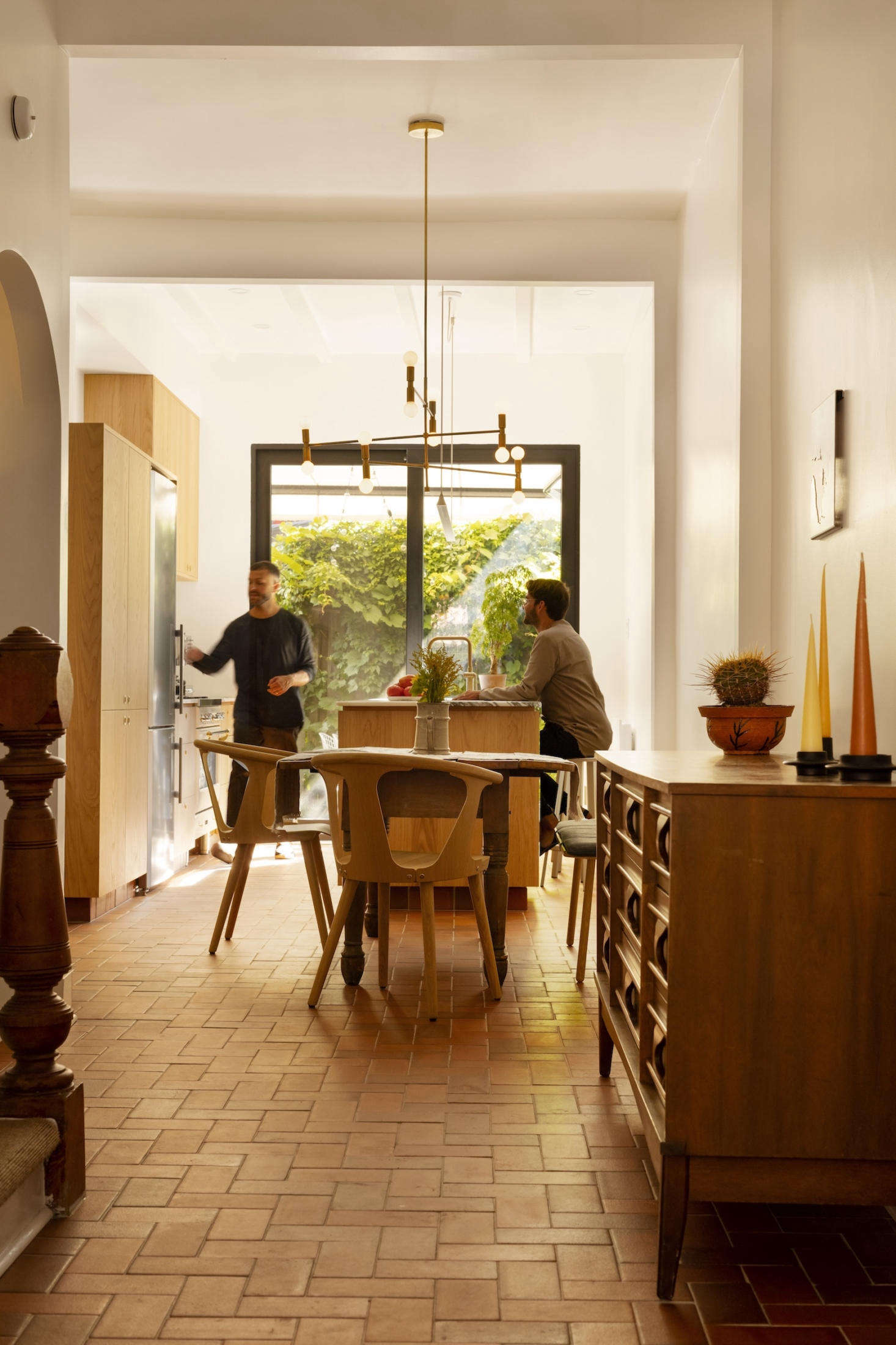 The kitchen, dining, and living rooms comprise the second floor. The terracotta tiled floors are new but replicate the original flooring in the kitchen.