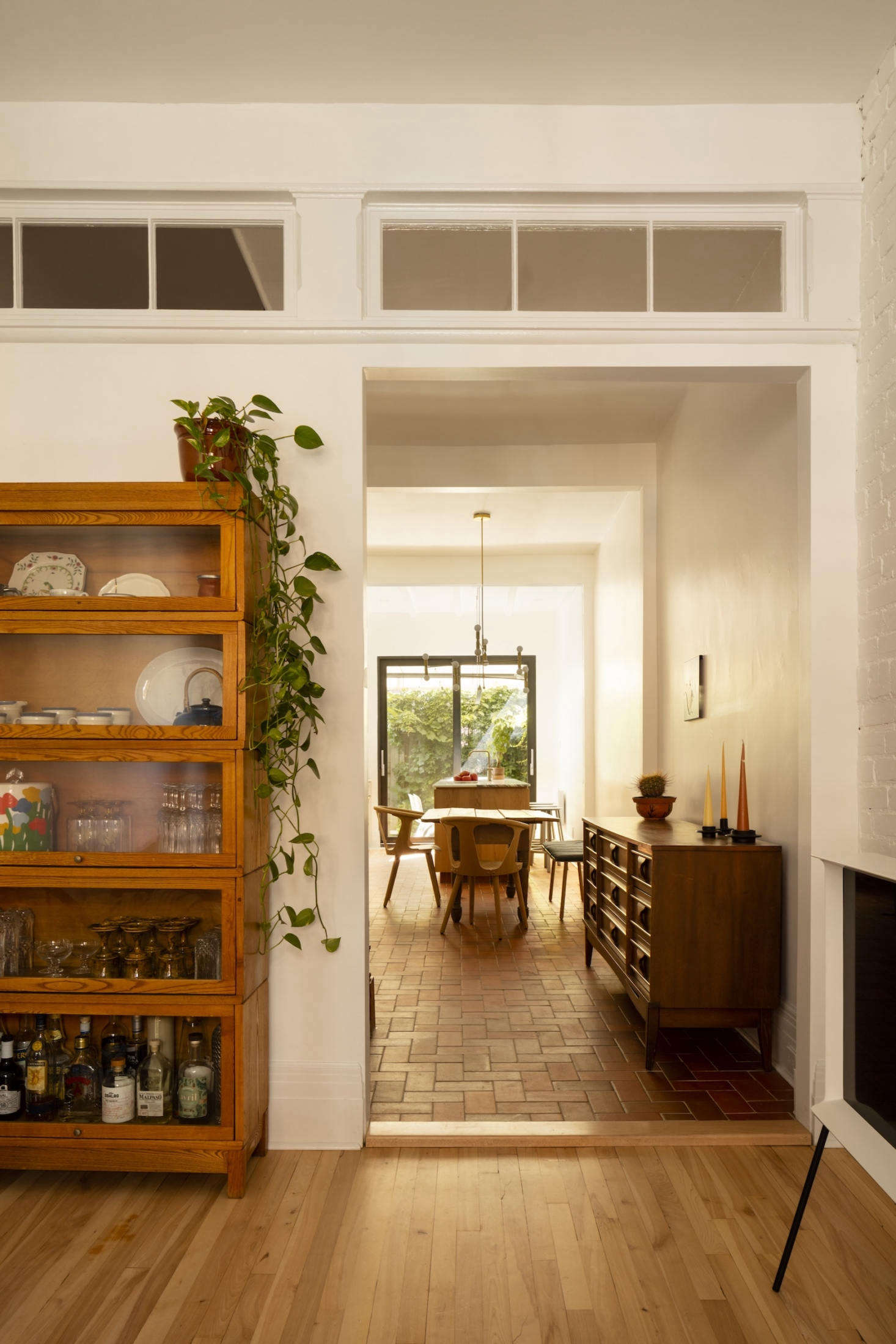 The long view, from the living room, toward the dining room, into the kitchen.