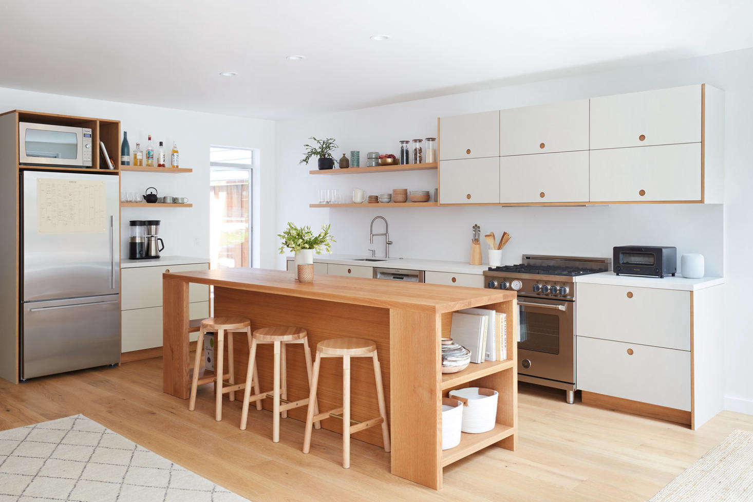 The white oak kitchen island is designed by Amy and constructed by a local woodworker. 